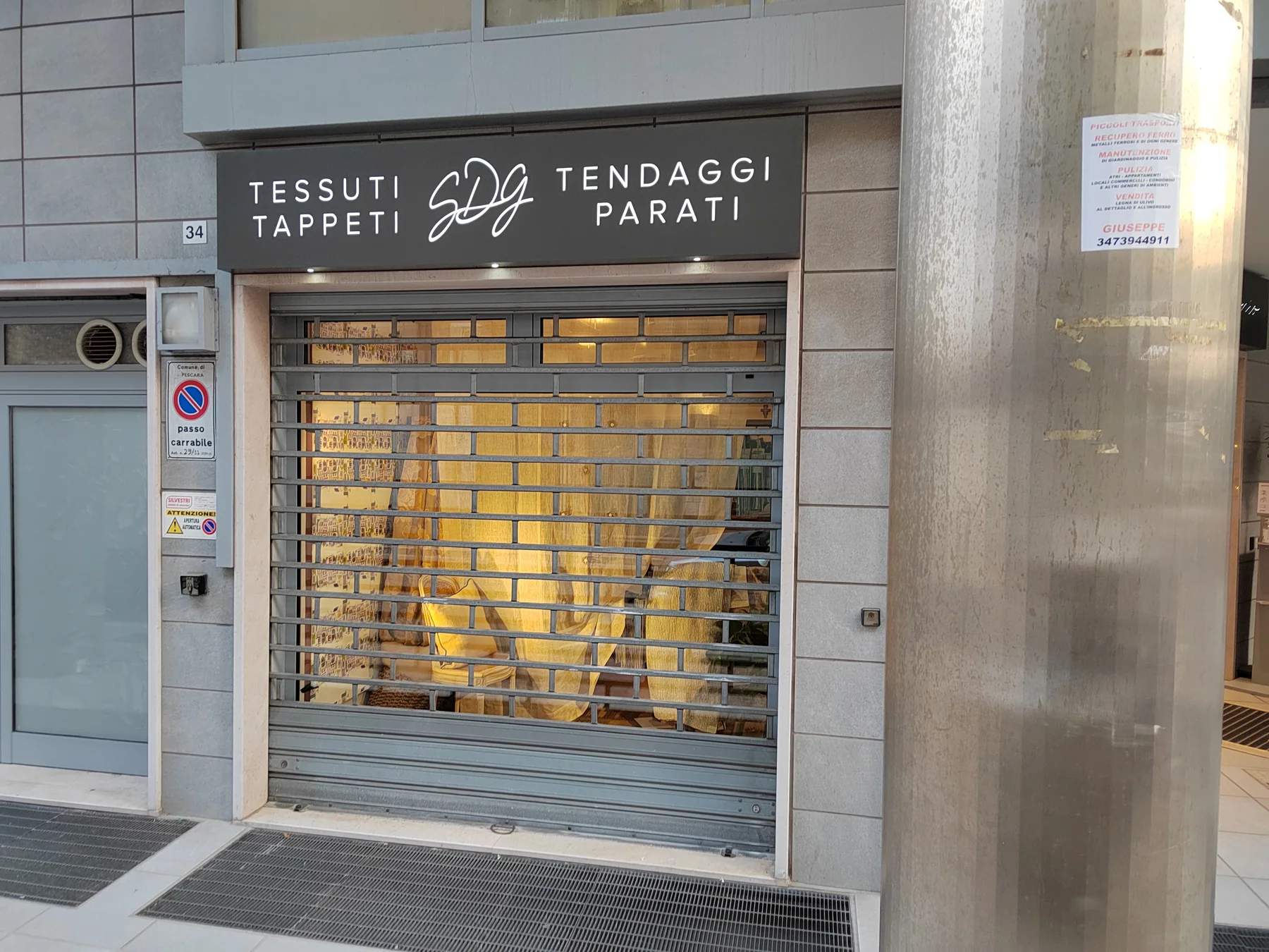 Insegna SDG Tessuti, Tappeti, Tendaggi e Parati